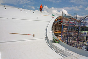 Shear barriers on a steep slope and an aluminium eaves profile as edging.