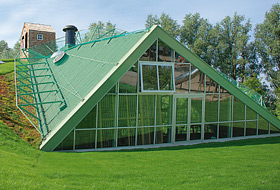 Gable-fronted dormer in the middle of the green roof area