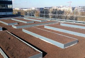 Roof garden with planting beds covered with substrate