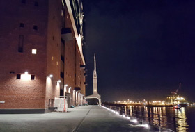 Brick building and quay at night