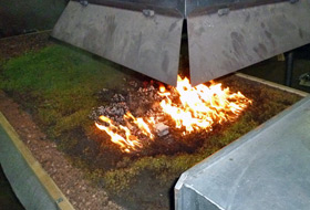 Dried-out area set alight using a naked flame applied externally